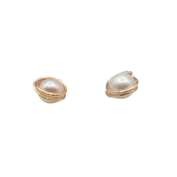 A pair of wrapped pearl stud earrings with 14K gold-fill metal, displayed against a white background.